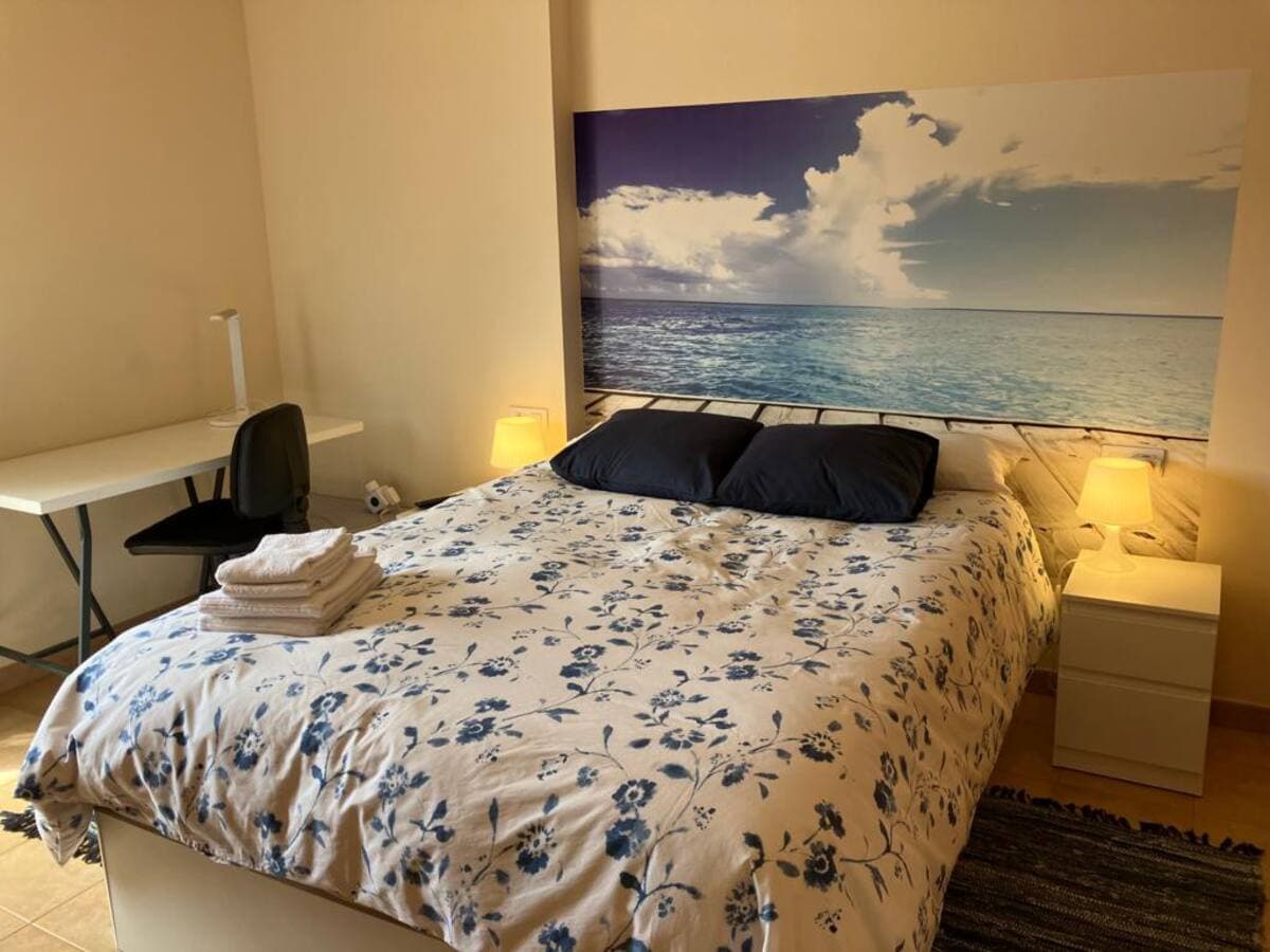 Spacious master bedroom with comfortable double bed for parents